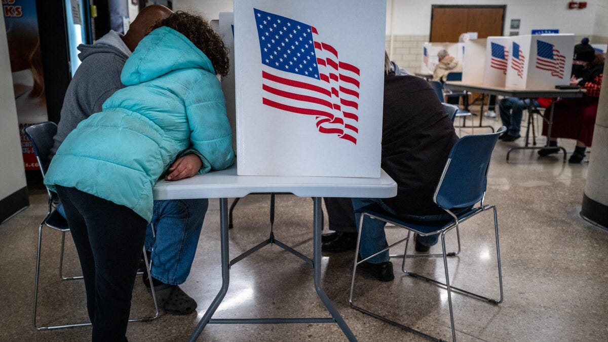 Woman voting at voting booth