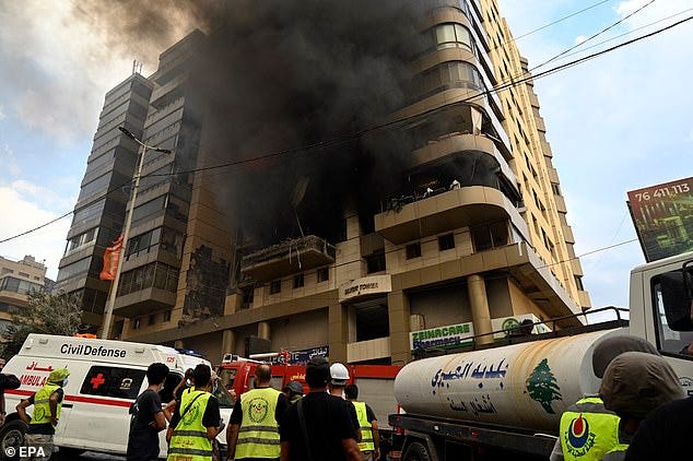 Smoke rises from a building following an Israeli military strike, in the southern suburbs of Beirut, Lebanon, 01 October 2024