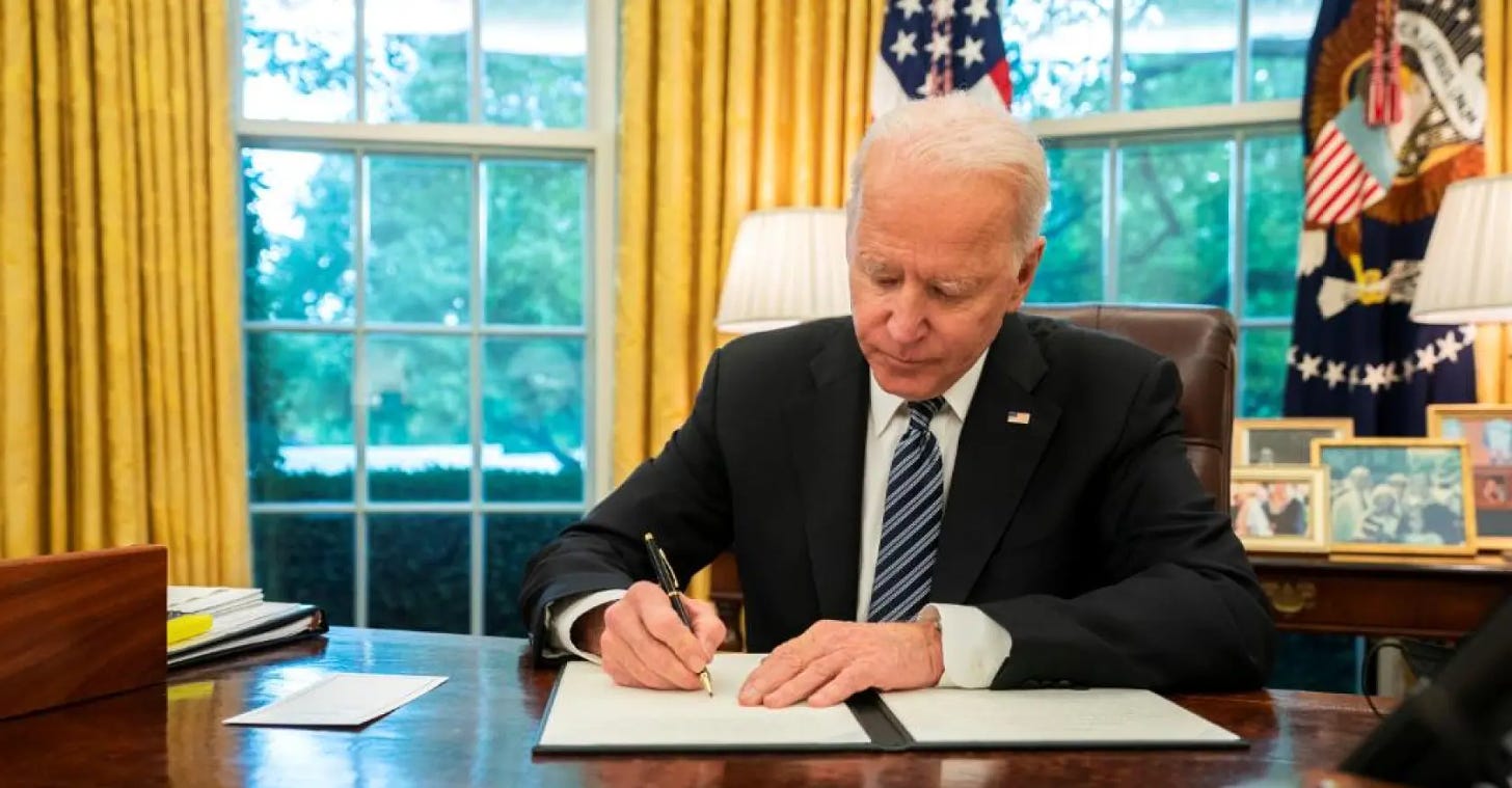 President Biden signing AI regulation executive order