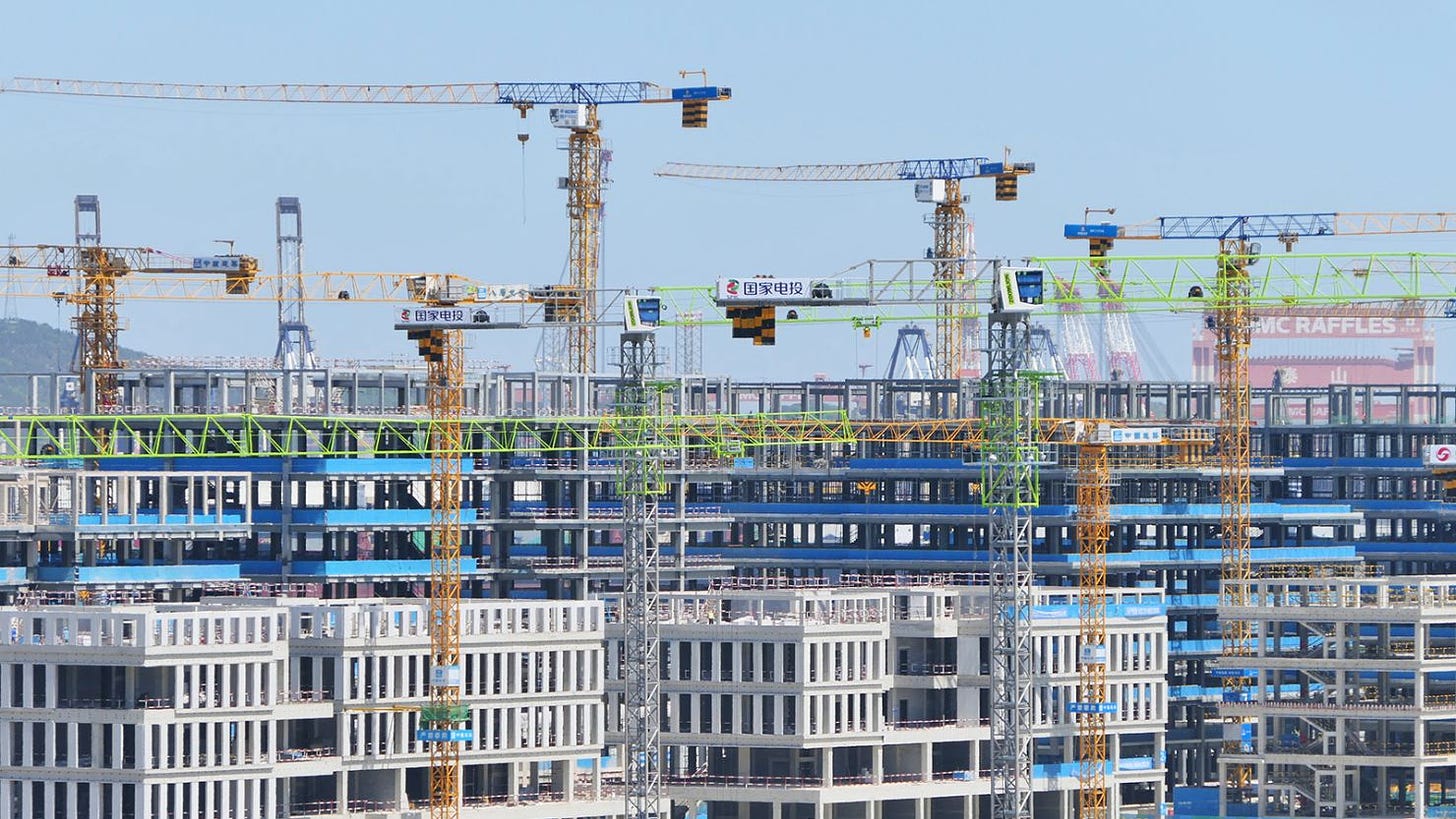 Tower cranes are seen at a real estate construction site in Yantai, Shandong province, China, on May 19, 2024.