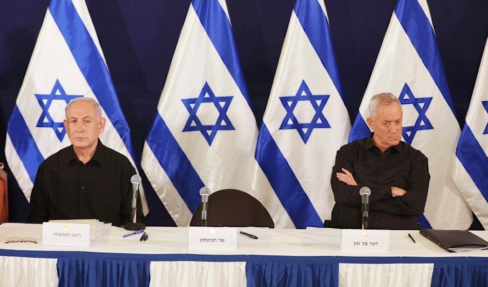 Israeli occupation Prime Minister Benjamin Netanyahu and then Cabinet Minister Benny Gantz attends a news conference in the Kirya military base in Tel Aviv, 'Israel', on Oct. 28, 2023. (AP)