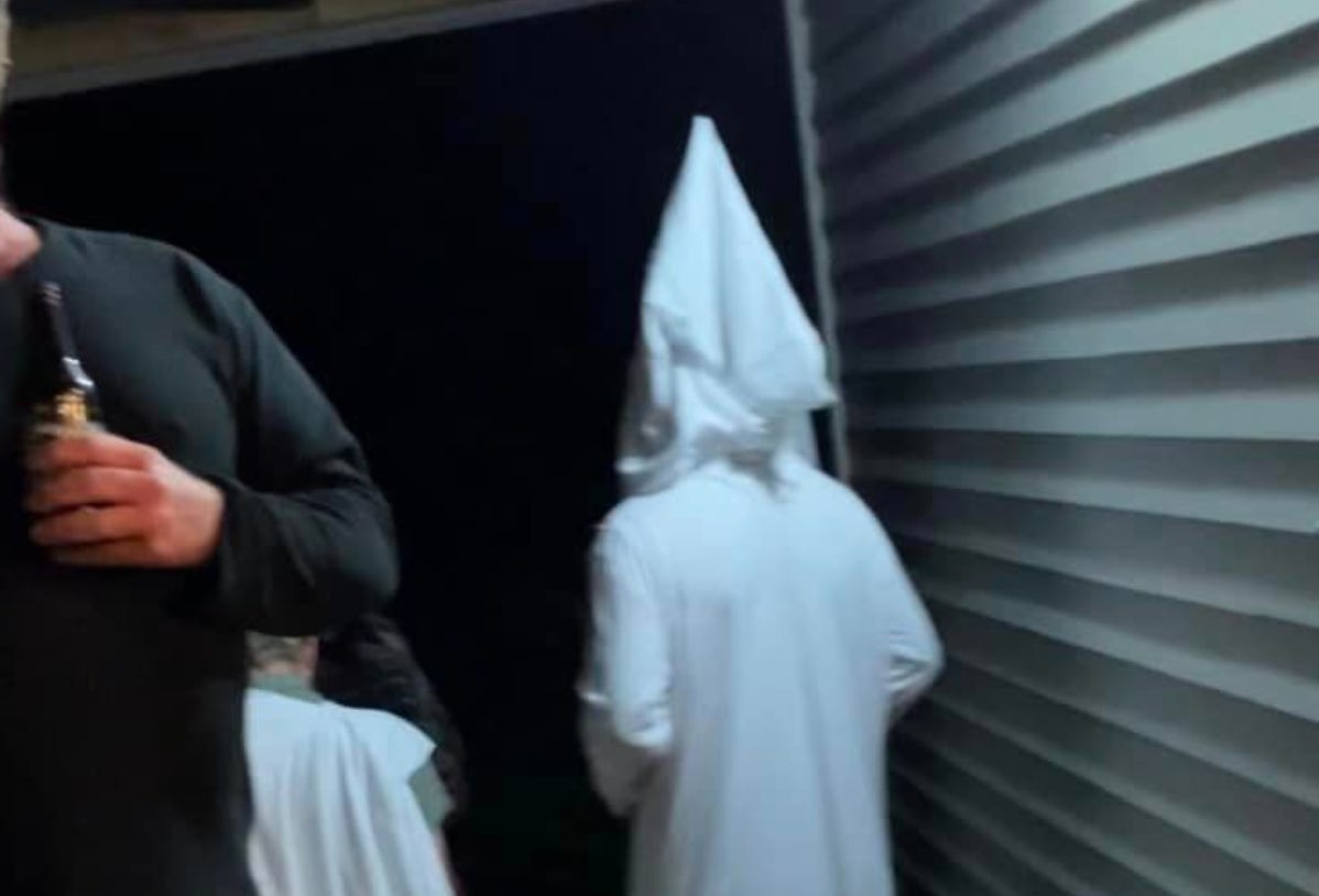 KKK costume leaving