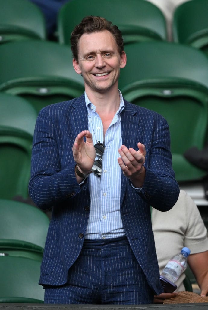 Tom Hiddleston in a blue striped blazer and matching pants.