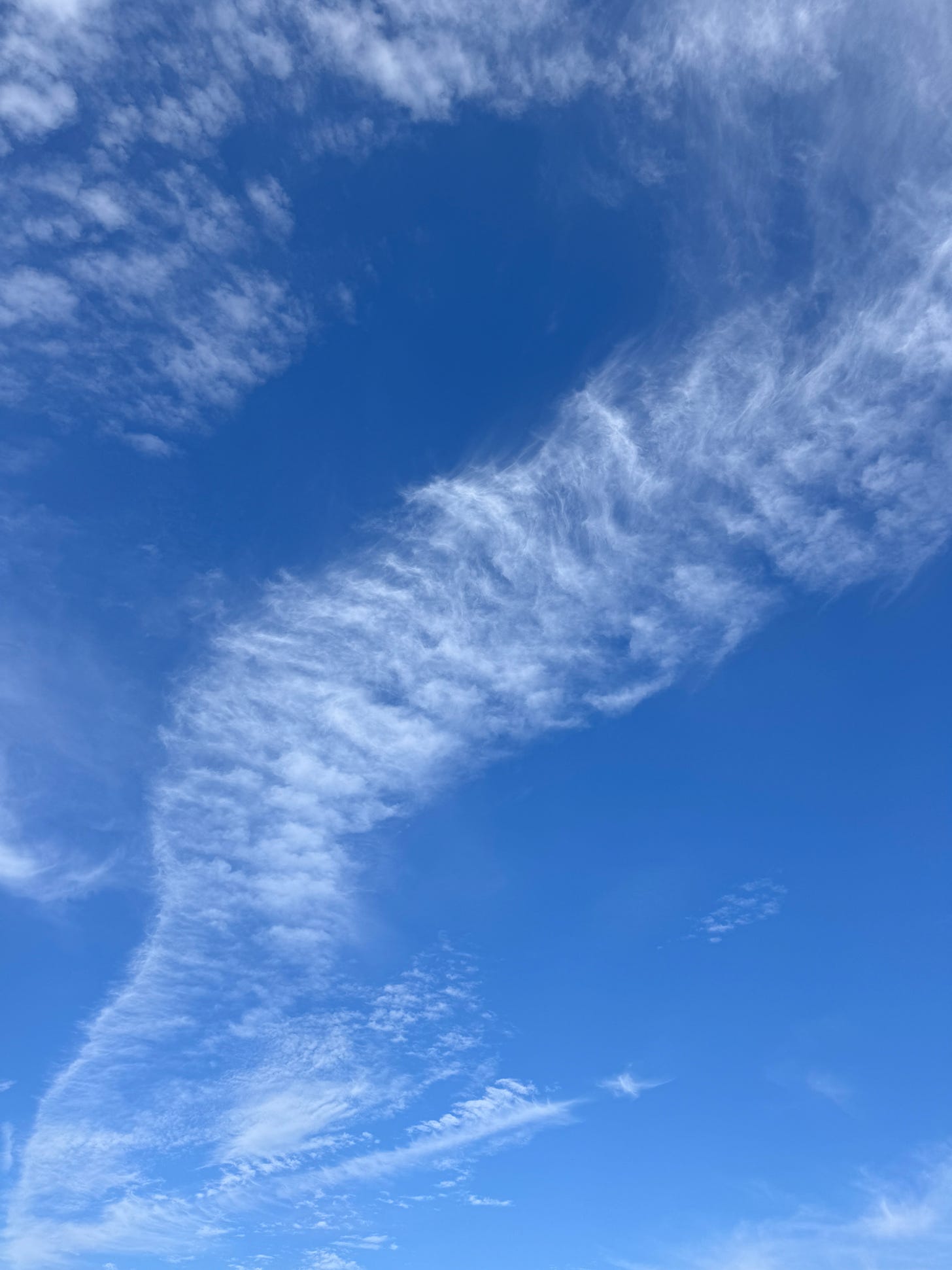 Wispy clouds against a beautiful blue sky