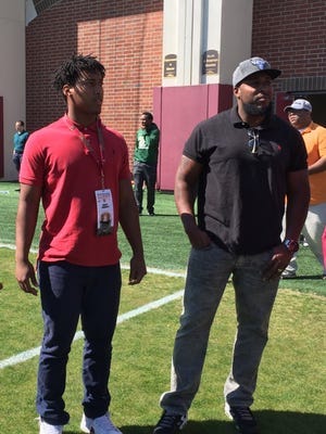 Former FSU linebacker Bradley Jennings, right, and his son, 2017 FSU linebacker commit Bradley Jennings Jr. check out spring practice on Monday, March 21, 2016.