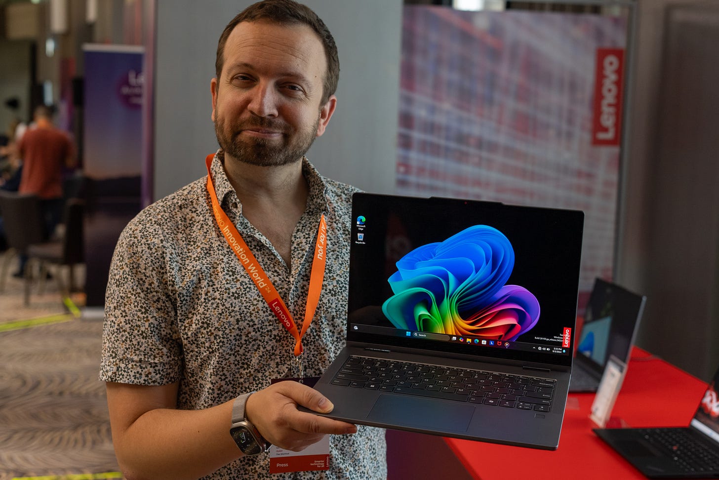 Lenovo IdeaPad 5x 2-in-1 laptop held by tech expert and journalist Matt Swider