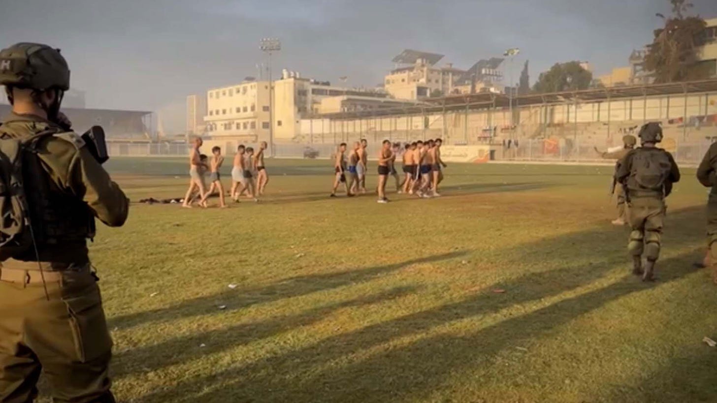 Video appears to show at least two children stripped and detained by IDF in  Gaza stadium among Palestinian men | CNN