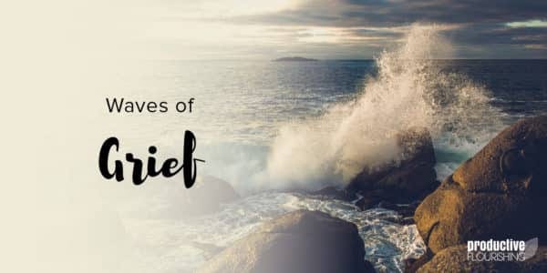 Waves crash against the rocks. Text Overlay: Waves Of Grief