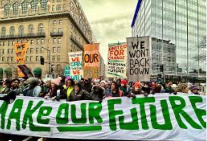 A group of people holding signs

AI-generated content may be incorrect.