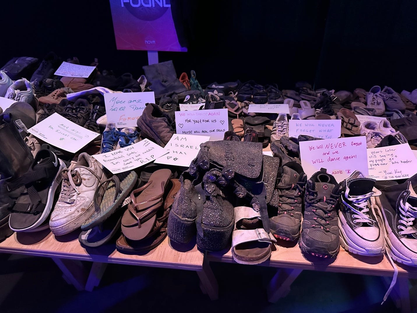 A table full of shoes

Description automatically generated