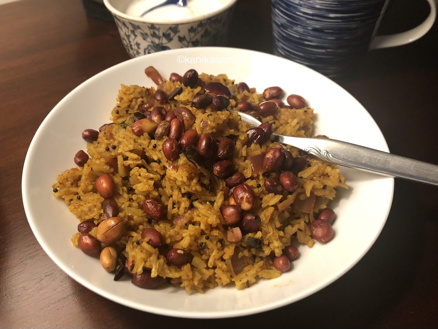 Tamarind rice made with leftover rice served in a white bowl