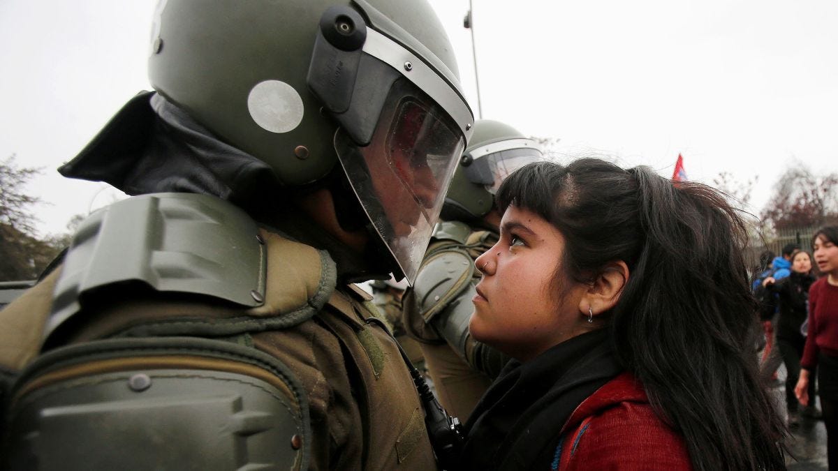 Chile demonstrator's defiant stare goes viral | CNN