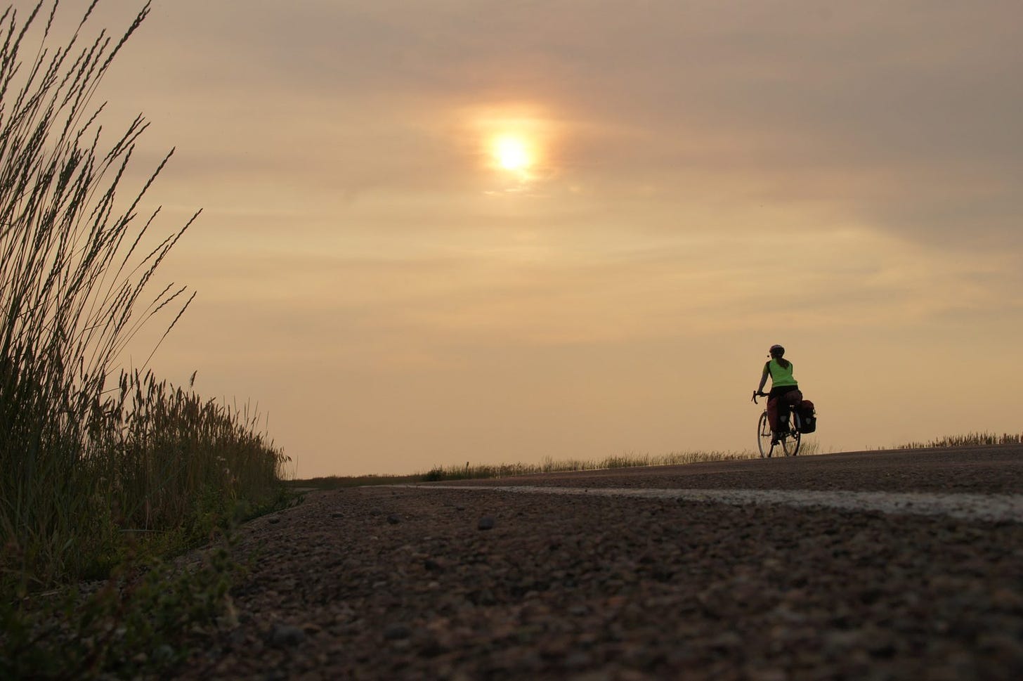 Wheat frames a hazy, fiery sunset in central Montana. Smoke from the fires in Washington made air quality bad for a couple days. 