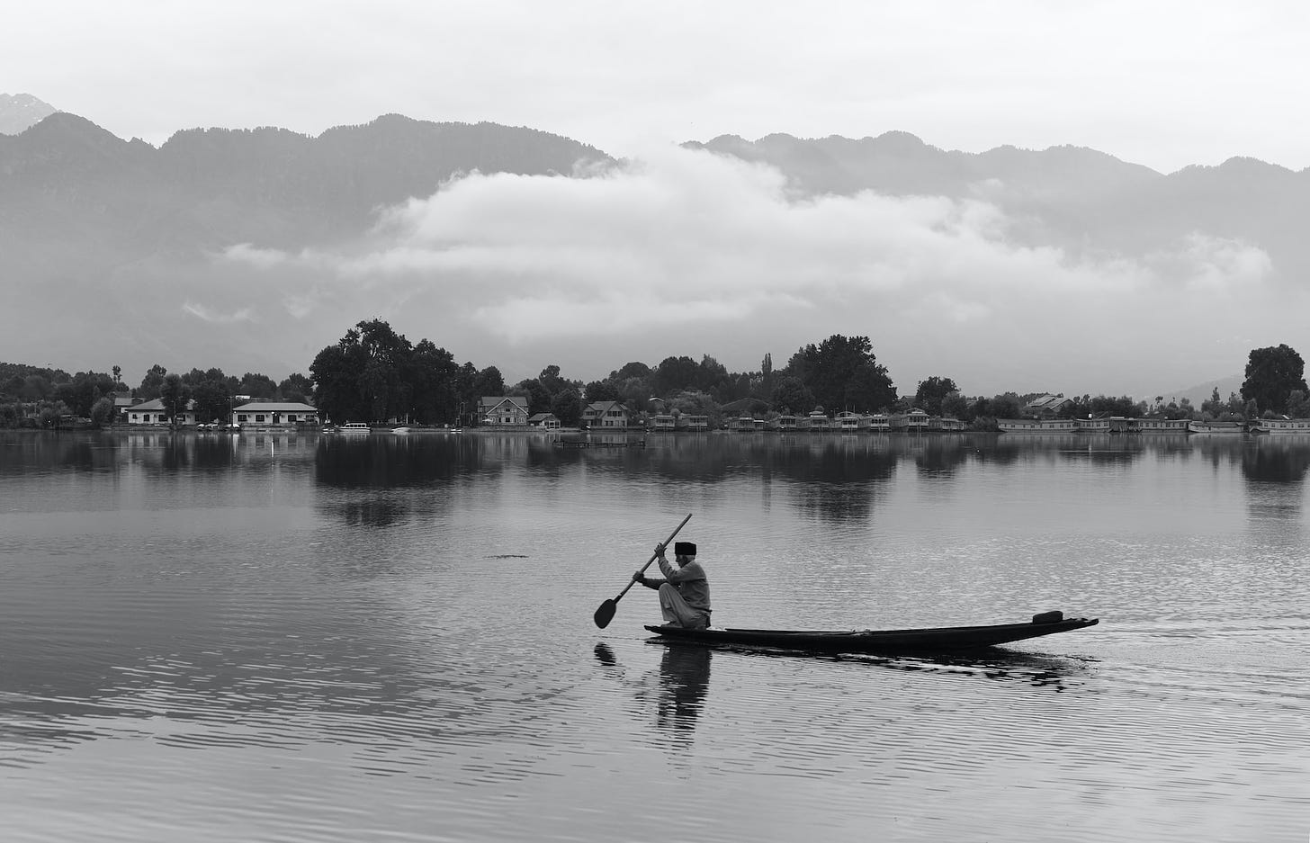 A boatman in a lake in Kashmir