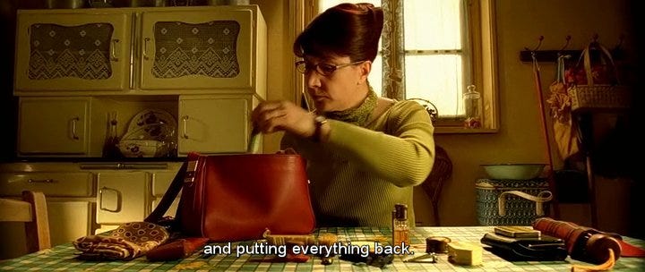 Shot from Amelie the film where her mom organizes her purse
