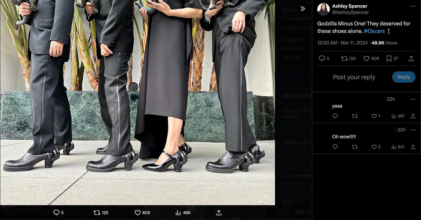 The Godzilla Minus One team wears Godzilla heel attachments on their shoes for their Oscars outfits.