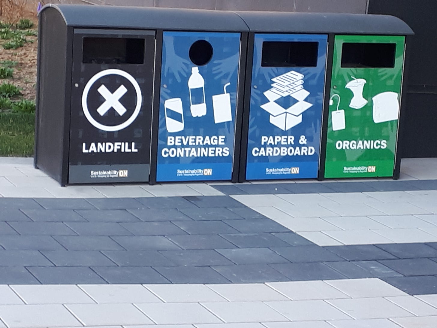 Waste receptacles with labels: landfill, beverage containers; paper; organics