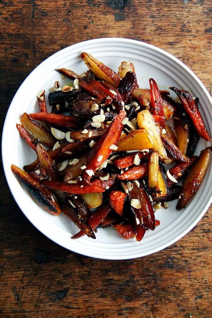 A bowl of roasted carrots.