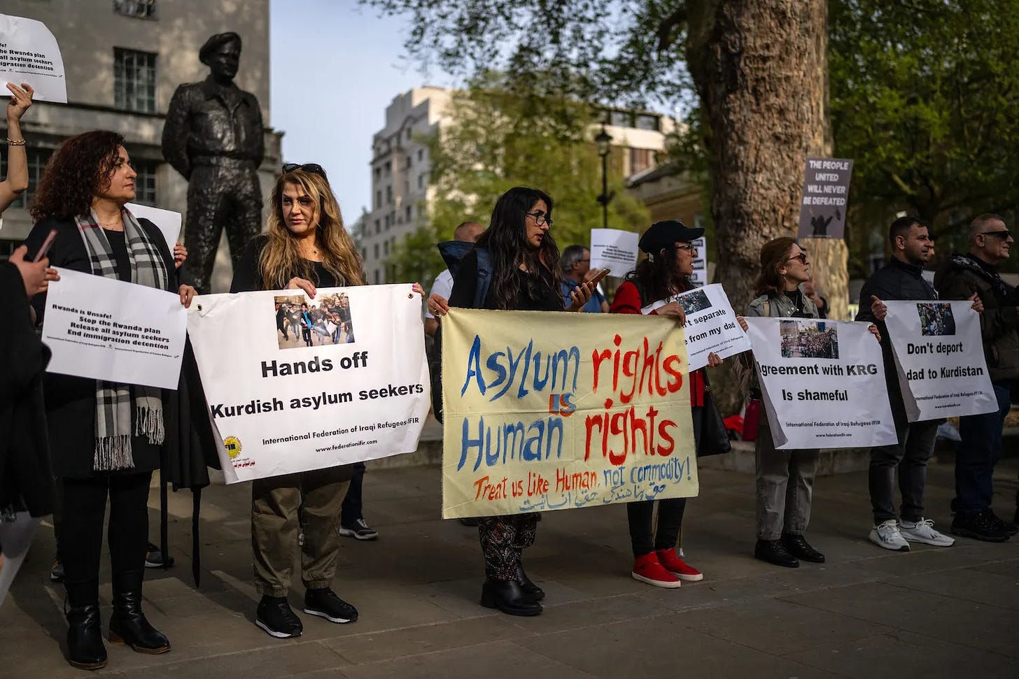 People protest against the Rwanda deportation bill outside Downing Street in London.