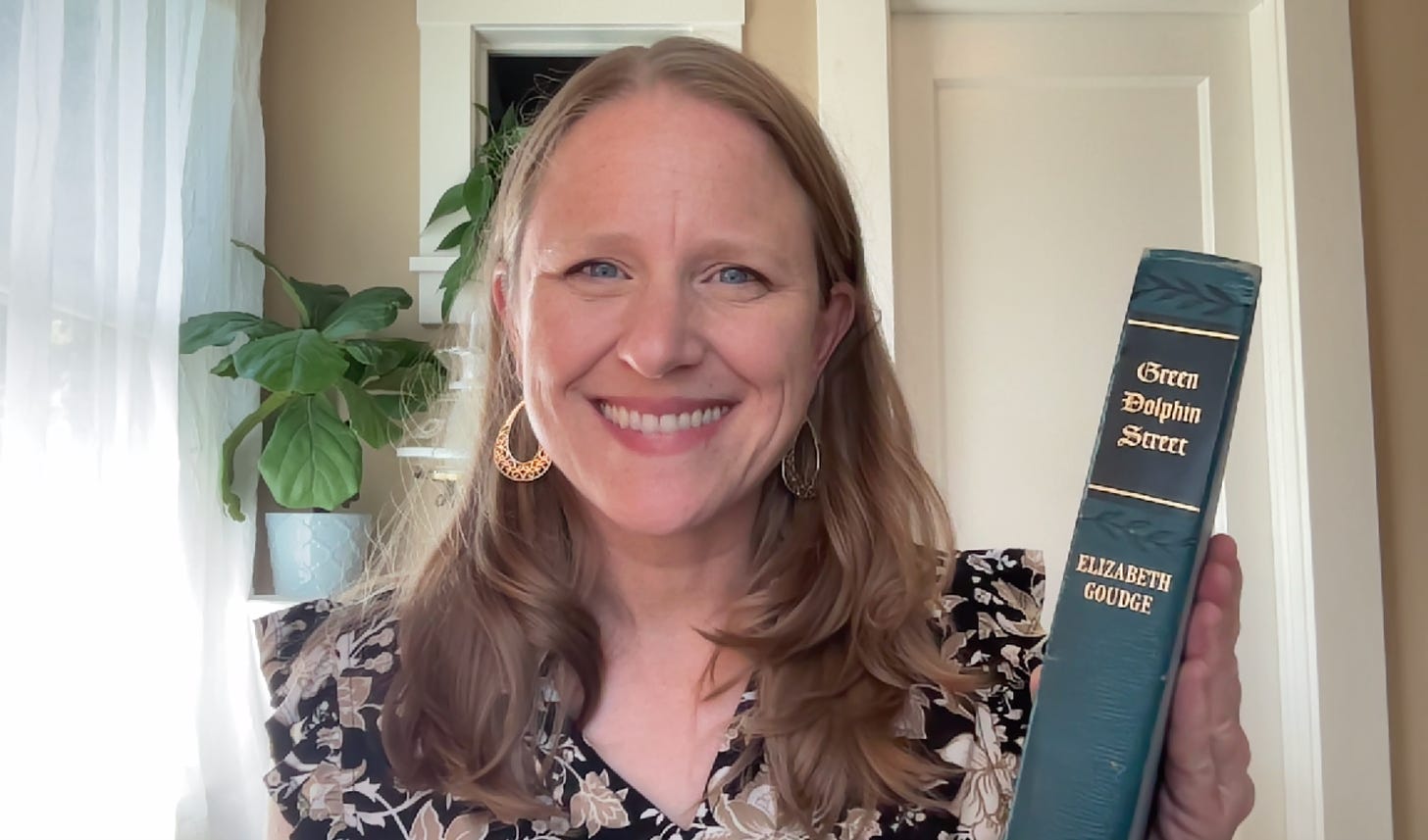 Book club leader Julie Witmer with her vintage copy of Green Dolphin Street by Elizabeth Goudge