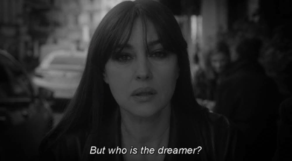 Black and white image of Monica Bellucci in David Lynch’s TWIN PEAKS: THE RETURN with white text saying “But who is the dreamer?”