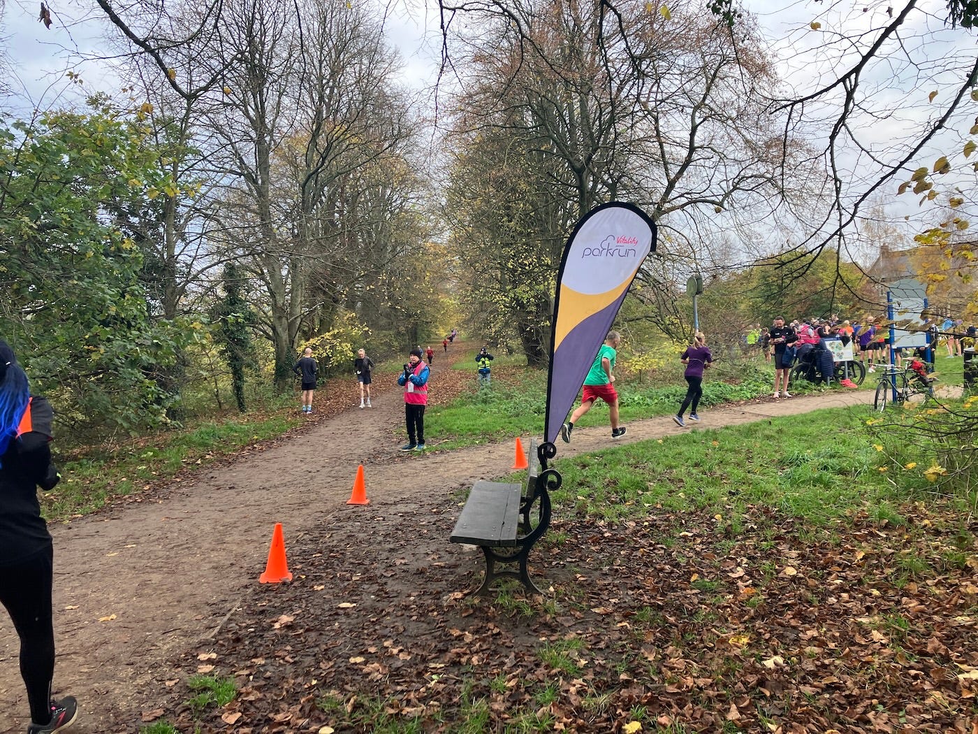 A parkrun flag and cones mark a turn