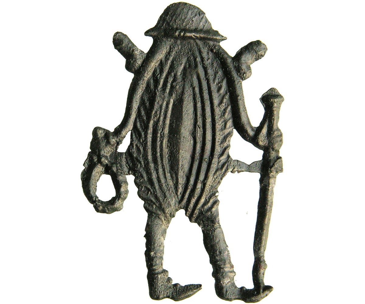 A medieval lead-tin badge in the shape of a vulva A medieval lead-tin badge in the shape of a vulva