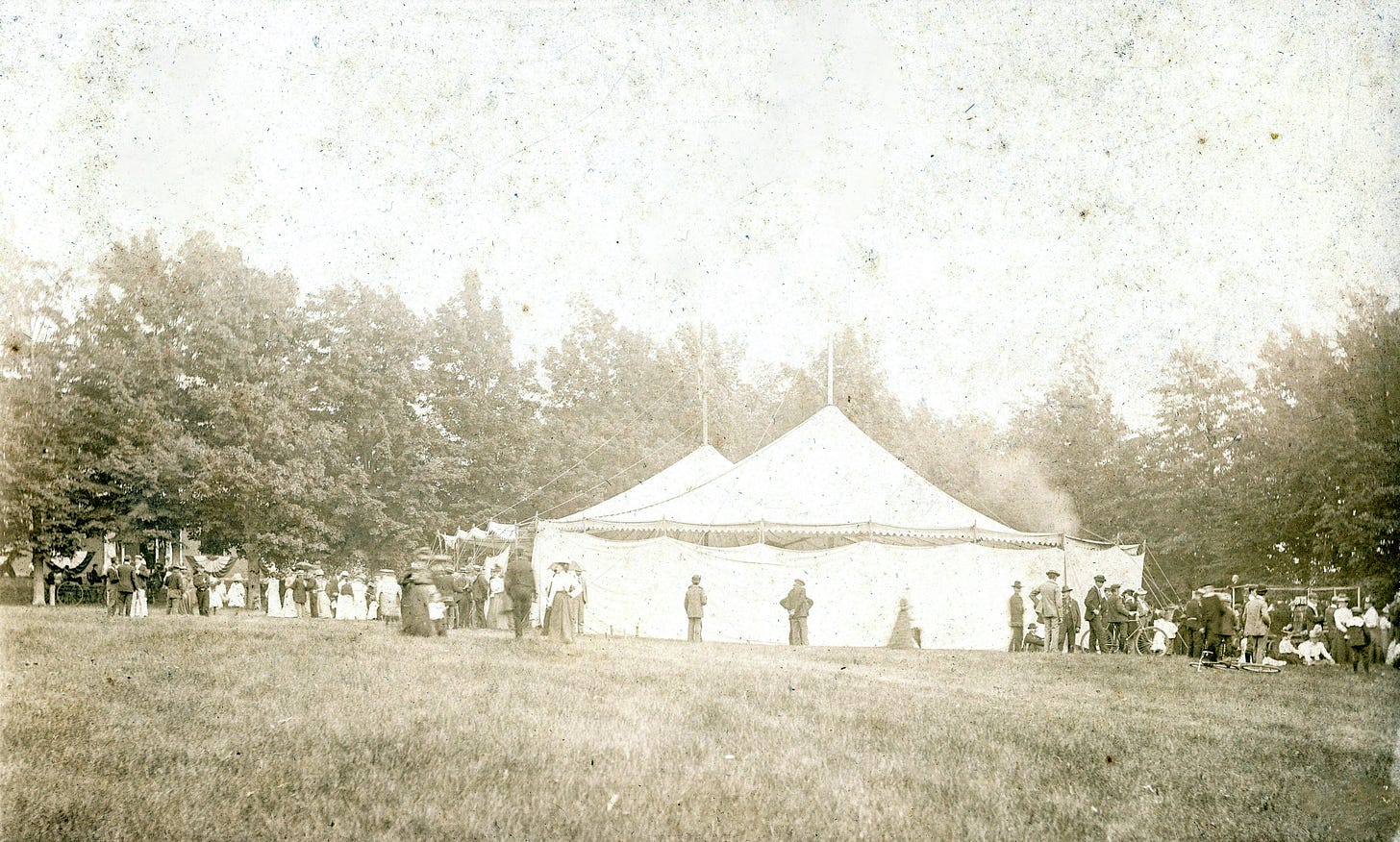 tent with people standing around