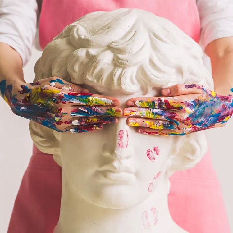 Artist with paint-covered hands covering eyes on a bust of David representing Margaret Atwood's muse.