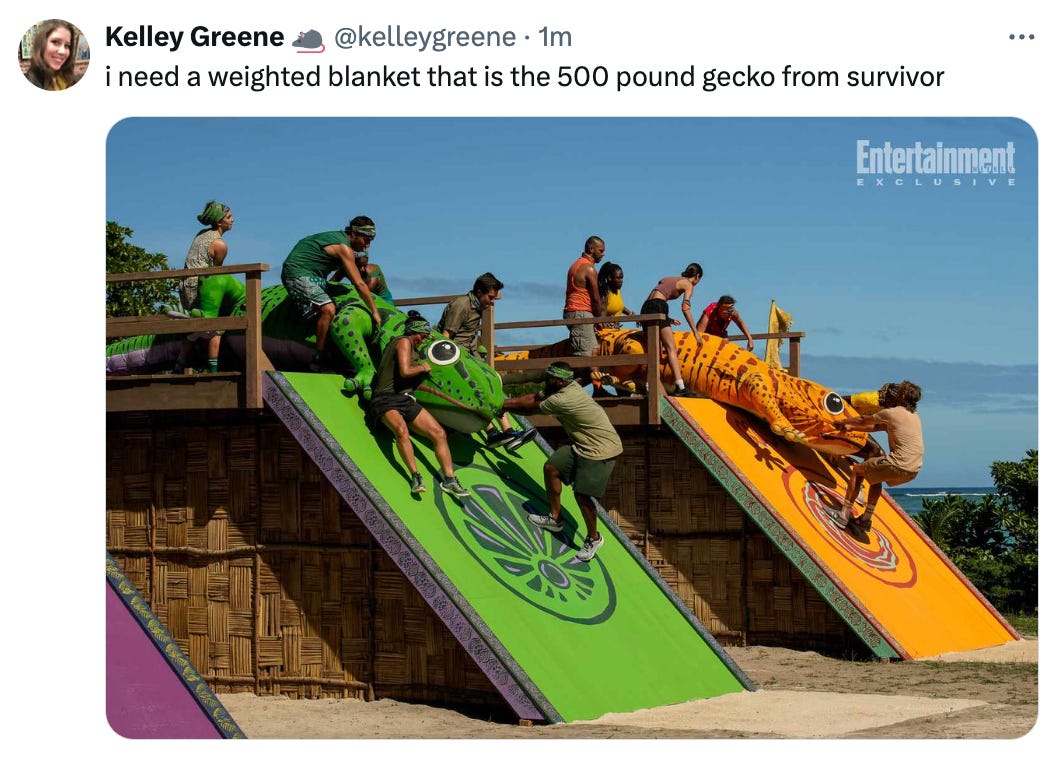Tweet from @kelleygreene that reads "i need a weighted blanket that is the 500 pound gecko from survivor" and features an image of two of the teams (yellow and green) dragging giant stuffed geckos through an obstacle course