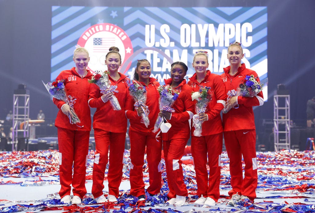 ST LOUIS, MISSOURI - JUNE 27: (L-R) Jade Carey, Sunisa Lee, Jordan Chiles, Simone Biles, Mykayla Skinner and Grace McCallum, the women that will represent Team USA, pose following the Women's competition of the 2021 U.S. Gymnastics Olympic Trials at America’s Center on June 27, 2021 in St Louis, Missouri. (Photo by Jamie Squire/Getty Images)