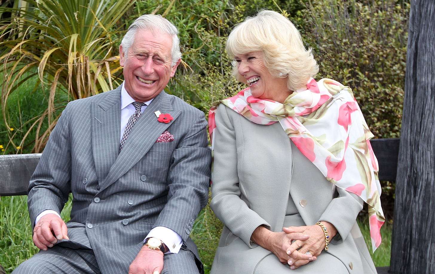 prince charles and camilla laughing at an engagement