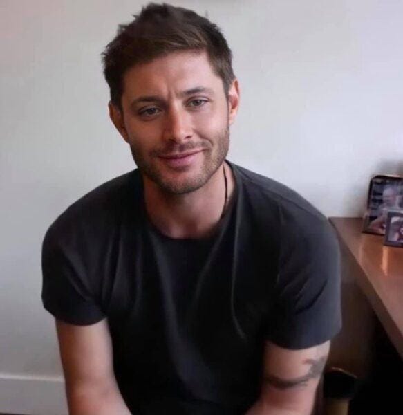 Jensen Ackles flexing tight shirt for Jared Padalecki