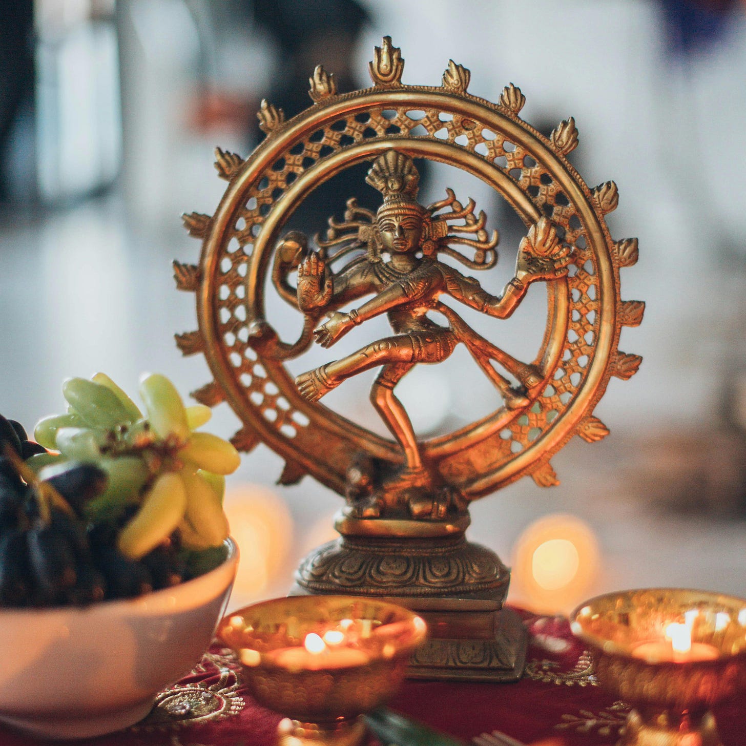 Shiva Nataraja Figurine Surrounded by Lighted Tealights · Free Stock Photo