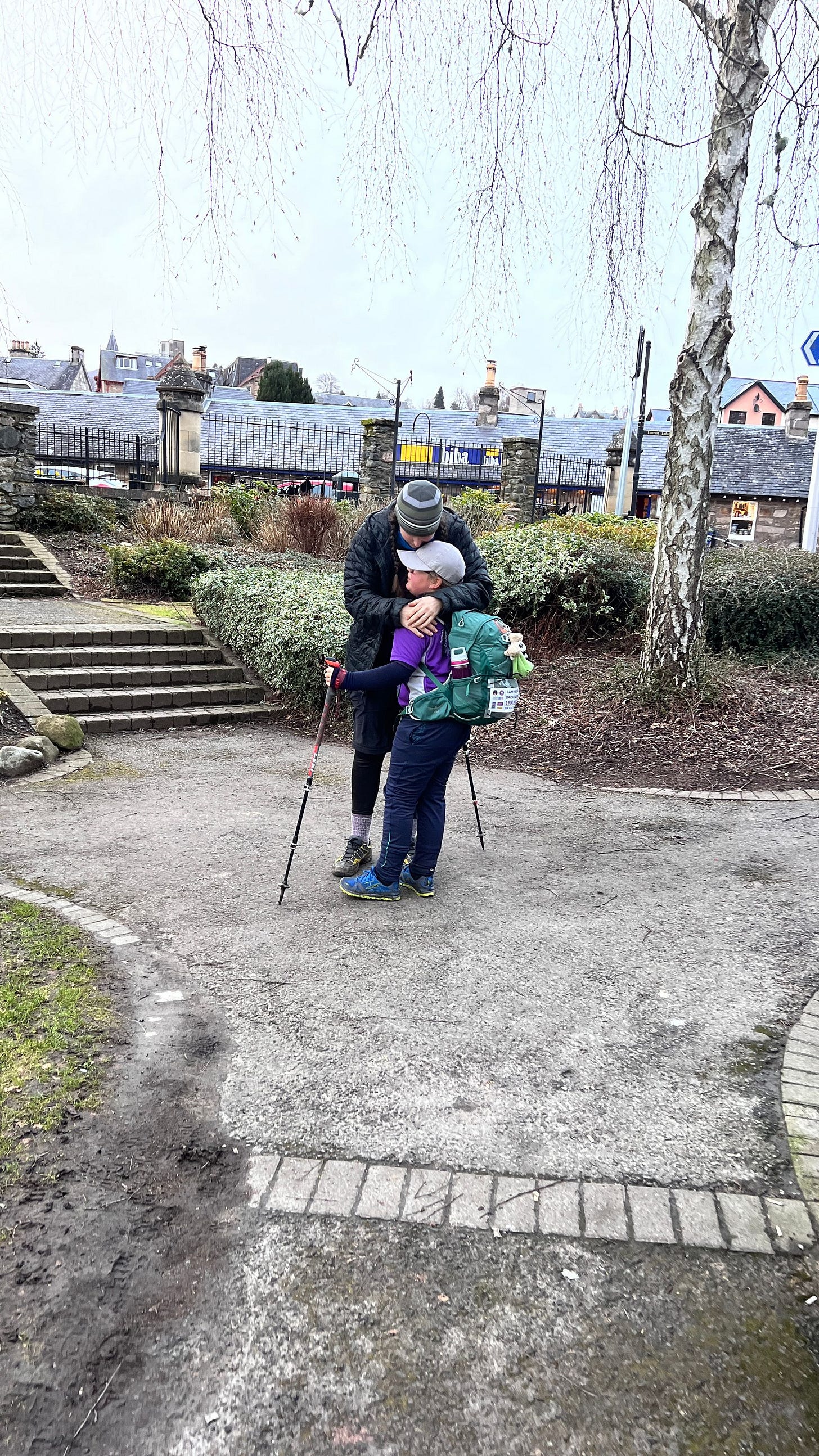 Sarah and Eve having a cuddle in the memorial gardens, the unofficially end of the Rob Roy Way