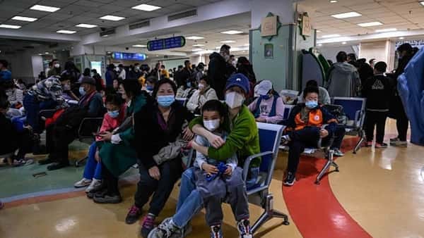 Crowds wearing masks seen at Beijing Hospital after pneumonia surge