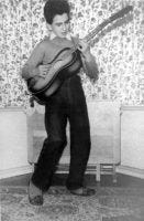 George Harrison playing the guitar, circa 1950