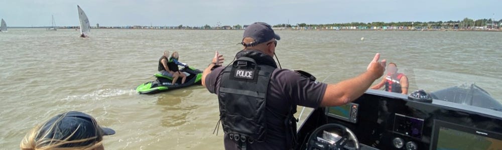 Marine Unit officers engaging with personal watercraft users.