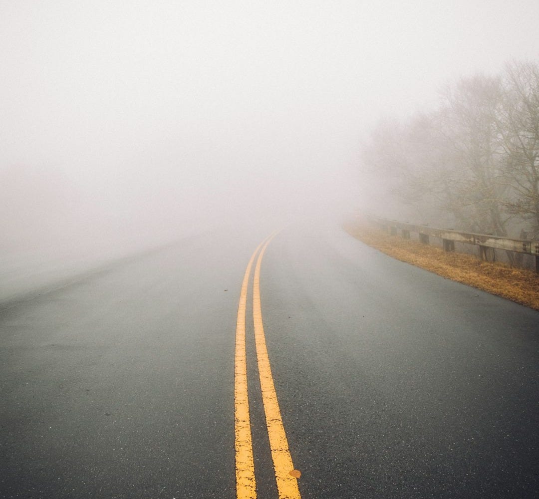 foggy gray concrete road