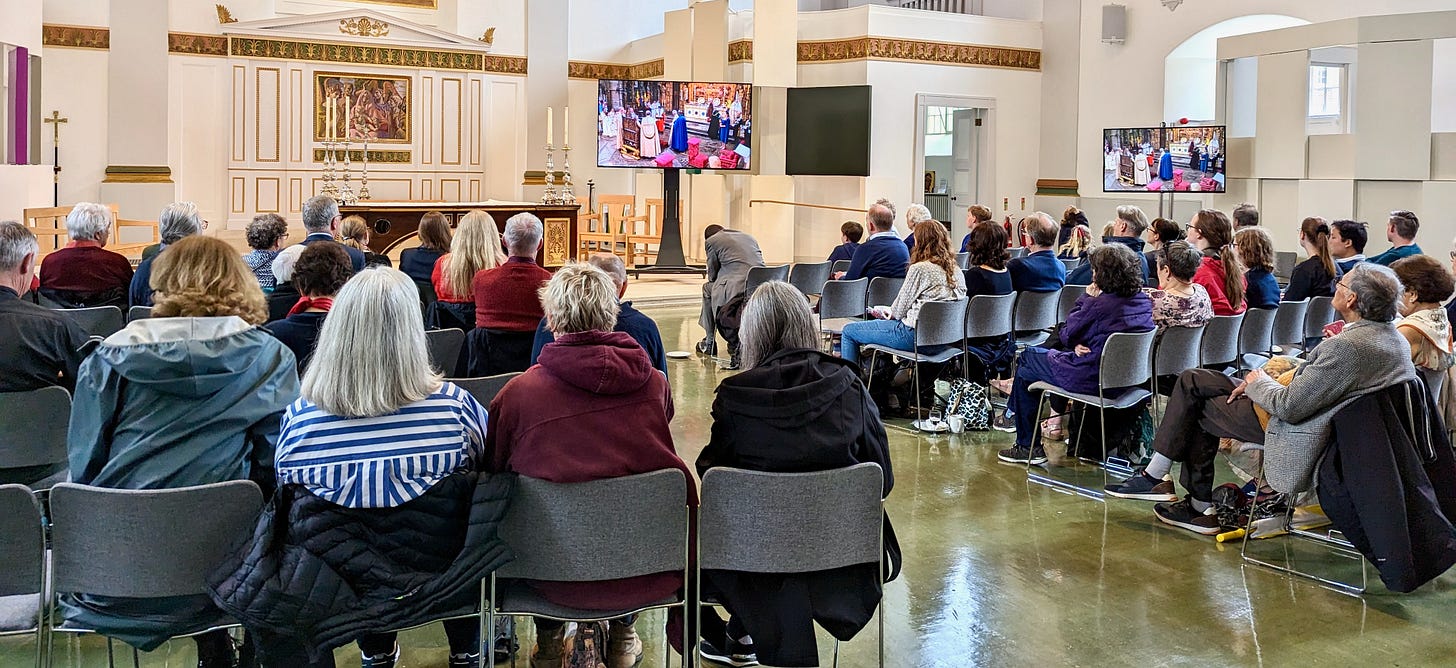 Residents watching the coronation in St John's Church