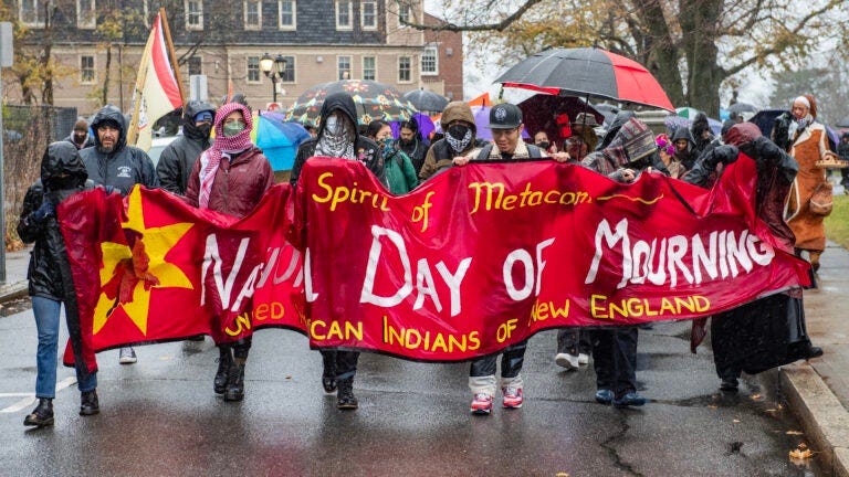 People march during the National Day of Morning protest on Thanksgiving Day, in Plymouth, Massachusetts, on November 28, 2024. An annual tradition since 1970, the National Day of Mourning aims at creating awareness of, and solidarity with, Native peoples and history around the world.