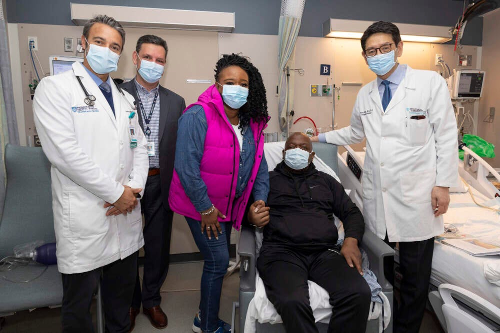 Patient Rick Slayman, seated, with (from left to right) Dr. Leo Riella, medical director of kidney transplantation, Dr. Nahel Elias, interim chief in the division of transplant surgery, Slayman's partner, Faren, and Dr. Tatsuo Kawai, director of the Legorreta Center for Clinical Transplant Tolerance. (Courtesy Mass General Hospital)