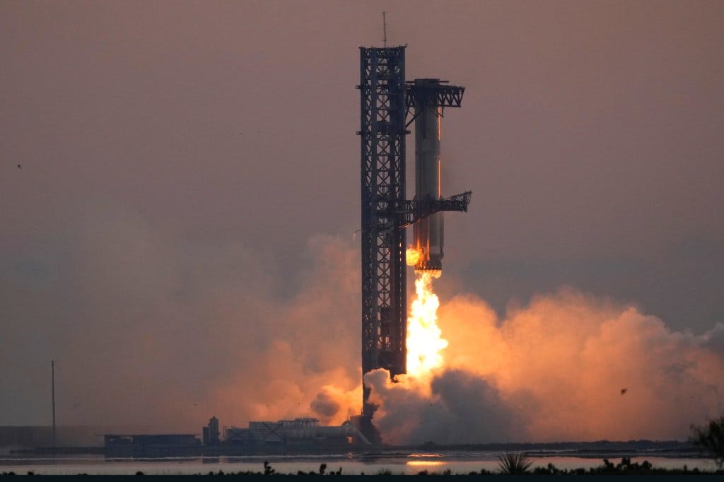 SpaceX's mega rocket booster returns to the launch pad to be captured during a test flight Sunday, Oct. 13, 2024, in Boca Chica, Texas.