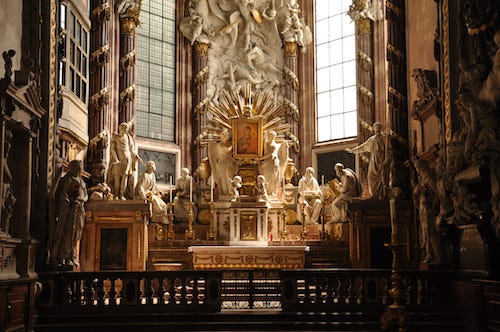 cathedral altar surrounded by sculptures