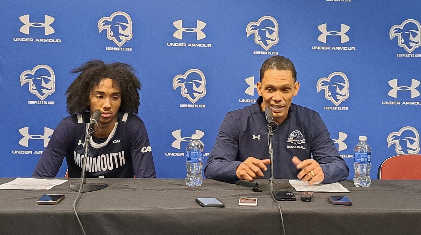 Coach King Rice (right) and Abdi Bashir Jr. speak to reporters after Monmouth upset Seton Hall on Nov. 30, 2024. (Photo by Adam Zielonka)