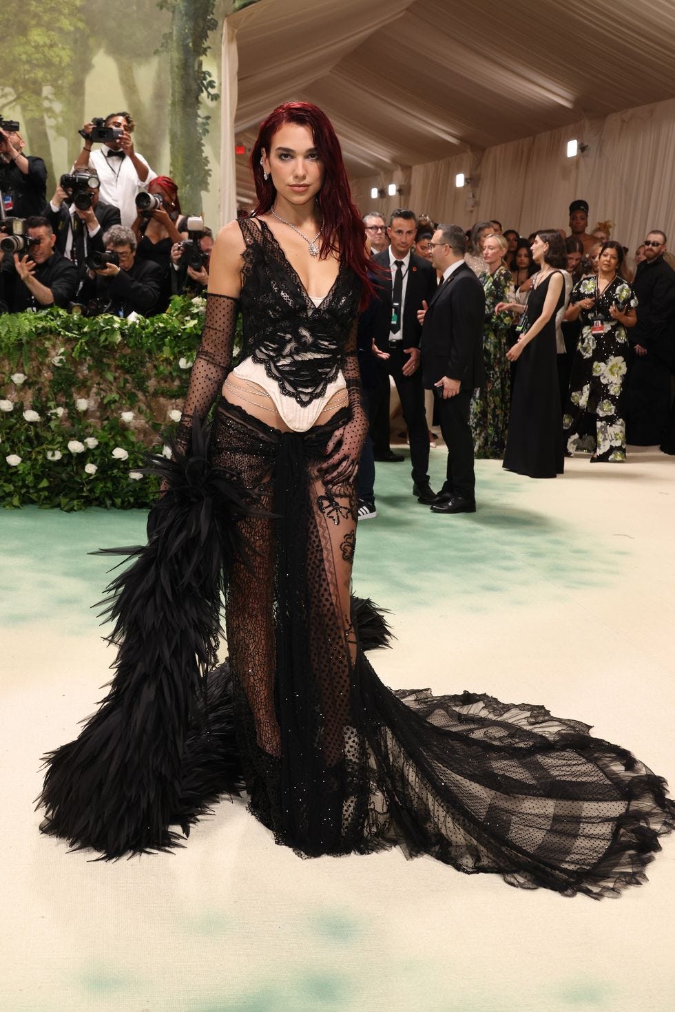 Dua Lipa Wears Feathers and Naked Lace at 2024 Met Gala