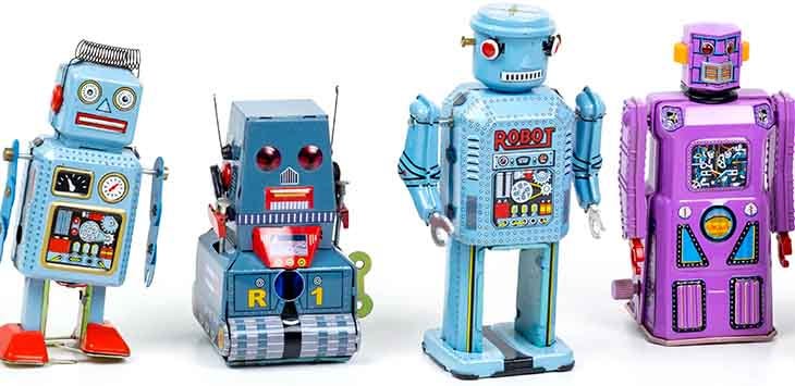 Photo of a row of toy tin robots.