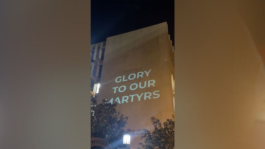 "Glory to our martyrs" sign
