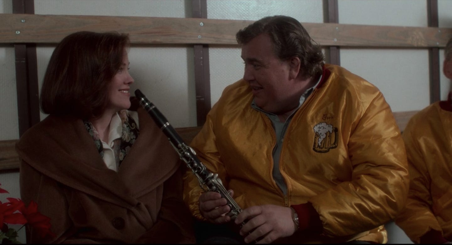 Screen grab from Home Alone featuring Catherine O'Harra, John Candy and a clarinet in the back of a van