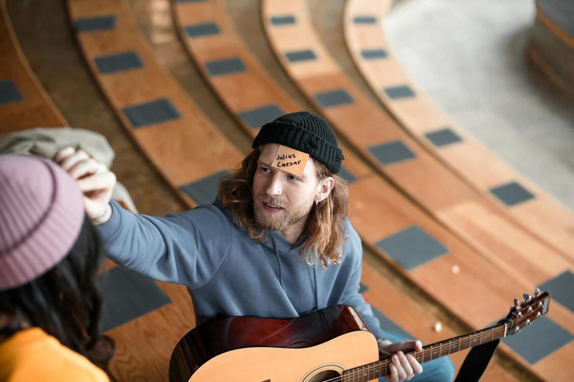 Free Man in Black Knit Hat with Sticky Note on HIs Forehead Stock Photo